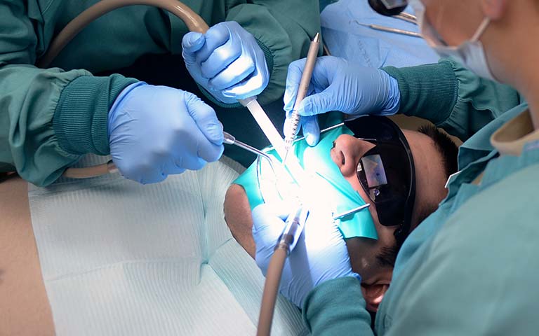 dental teem during dental filling procedure