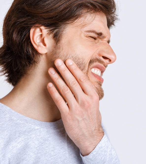 Man with severe dental pain.