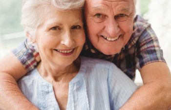 Happy senior couple with perfect smiles.