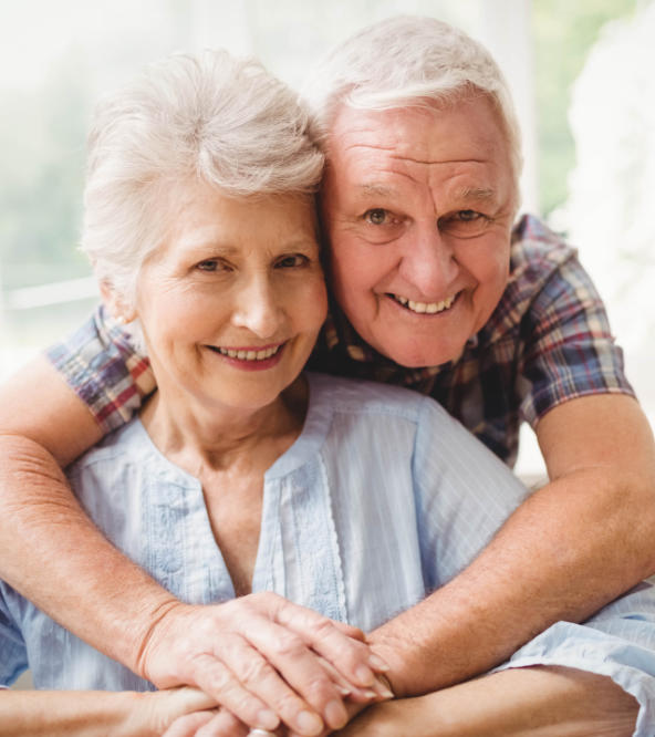 Happy senior couple with perfect smiles.