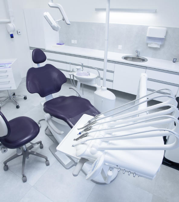 A dental chair and equipment in a treatment room at dentistry in West Hill, CT.