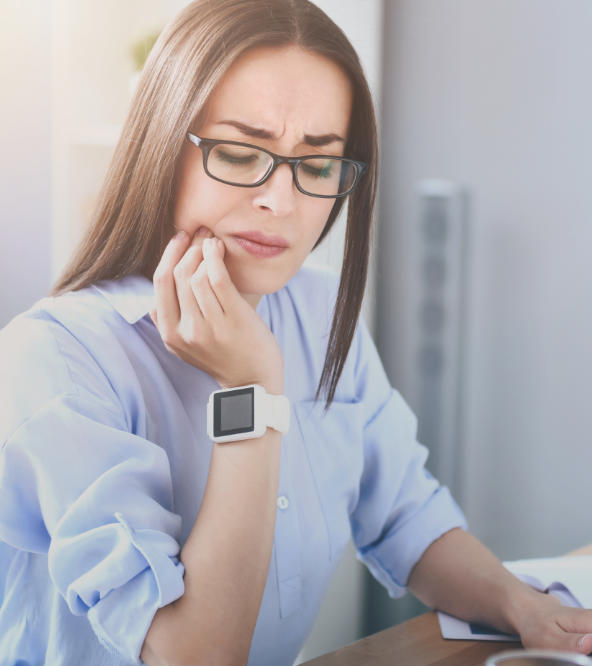 Concerned woman experiencing dental issue.