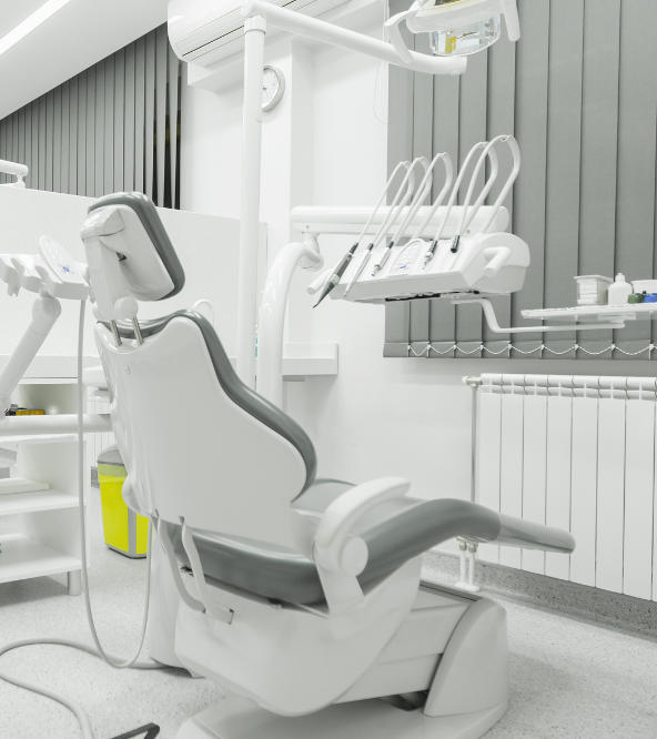 A dental chair and equipment in a treatment room at dentistry in West Hill, CT.