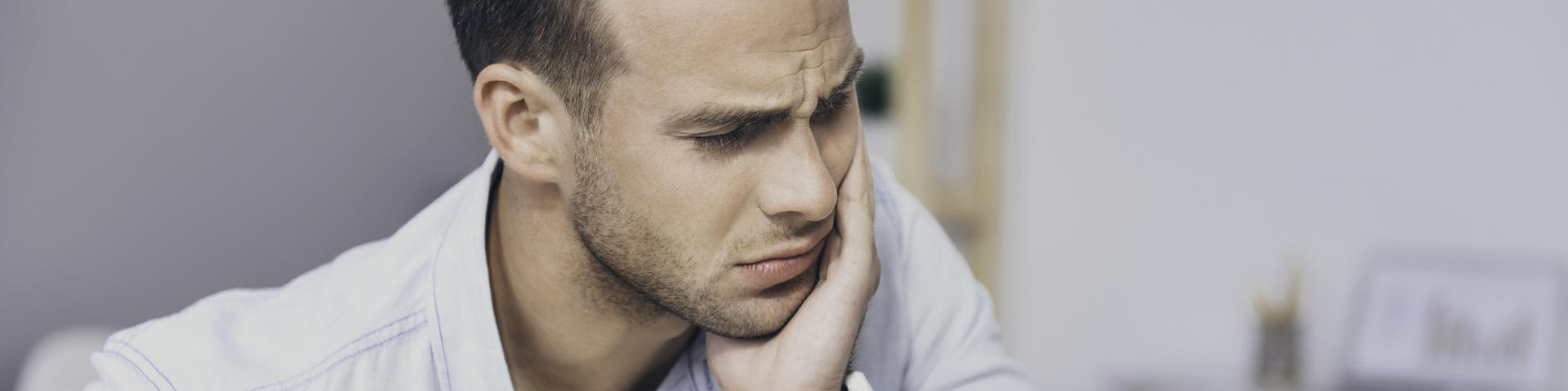 man with dental pain