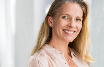 beautiful woman with blonde long hair looking at camera having excited and happy facial expression